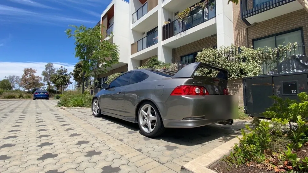 Grey Honda Integra Type R DC5 parked outside apartments